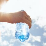 Hand,Holding,Water,Bottle,,Drinking,Water,,Body,Care,Health,Concept