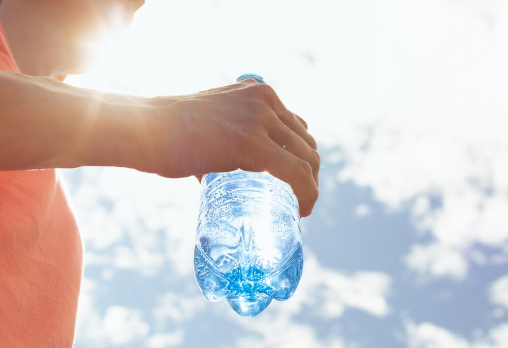 Hand,Holding,Water,Bottle,,Drinking,Water,,Body,Care,Health,Concept