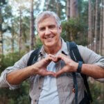 Portrait,,Heart,And,Senior,Man,In,Forest,Hiking,,Fitness,And