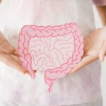 Preteen,Girl,Hands,Holding,Intestine,Shape,,Healthy,Bowel,Digestion,,Leaky