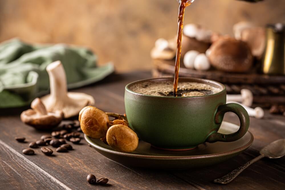 Trendy,Superfood,Mushroom,Coffee,Is,Pouring,In,Green,Cup,On