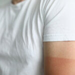 Close-up,Of,Man,Wearing,White,Shirt,With,Red,Mark,Of