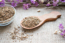 Dried,Valerian,Roots,In,Wooden,Spoon,On,Sackcloth,Background.,Valeriana